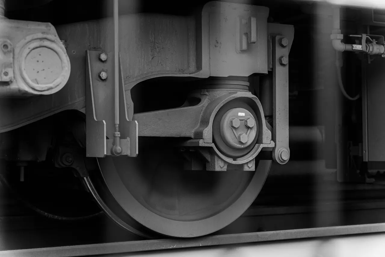 Close-up of a railway wheel and axle box